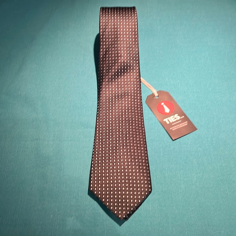 10 new ties from Ties.com. Whls. is $20. Black silk with lt.blue and silverdots.